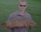 Aaron Whiteside 13lbs 8oz Carp from Upham Farm Ponds. Caught on a legered 21mm Marine Halibut Pellet.
