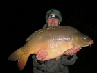 30lbs 2oz Mirror Carp from Sweet Chestnut Lake. Groundbait feeder, to open water, with maize as hookbait.