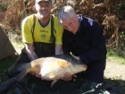 Michael Spinks 33lbs 7oz Mirror Carp, kt30.. Caught by Dominico (on the right)

his third ever fibleep