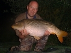 27lbs 8oz Common Carp from Les Burons Carp Fishing using Nutrabaits Trigga.. Caught fishing to right side of small island in 3 feet of water. Using Century NG Rods, Shimano 6000GTE reels, 15lbs