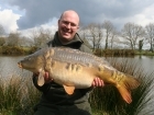 29lbs 3oz Mirror Carp from La Glehias using Quest Baits Rahja Spice.. Caught on gap in trees on far margin.